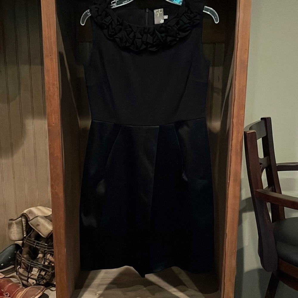 NWOT black formal dress size 6. Silky skirt and floral ruching at the neckline.